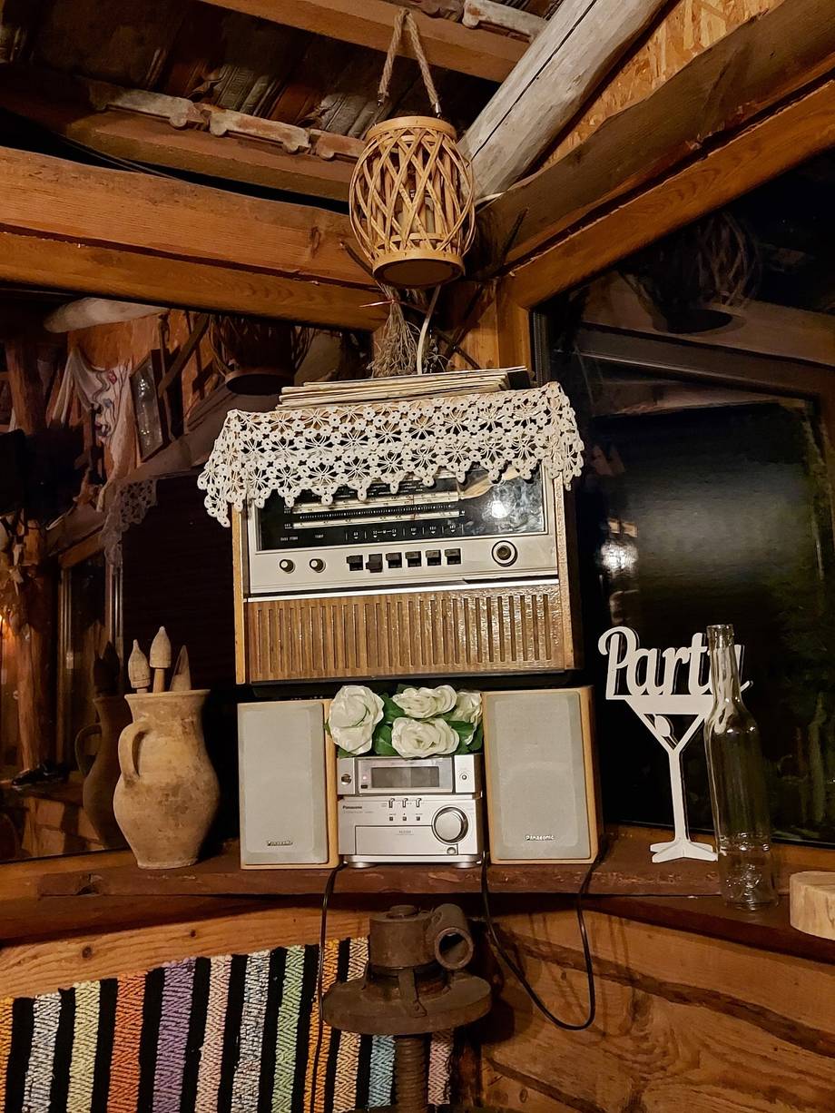 Vintage audio equipment and decor arrangement in wooden interior space