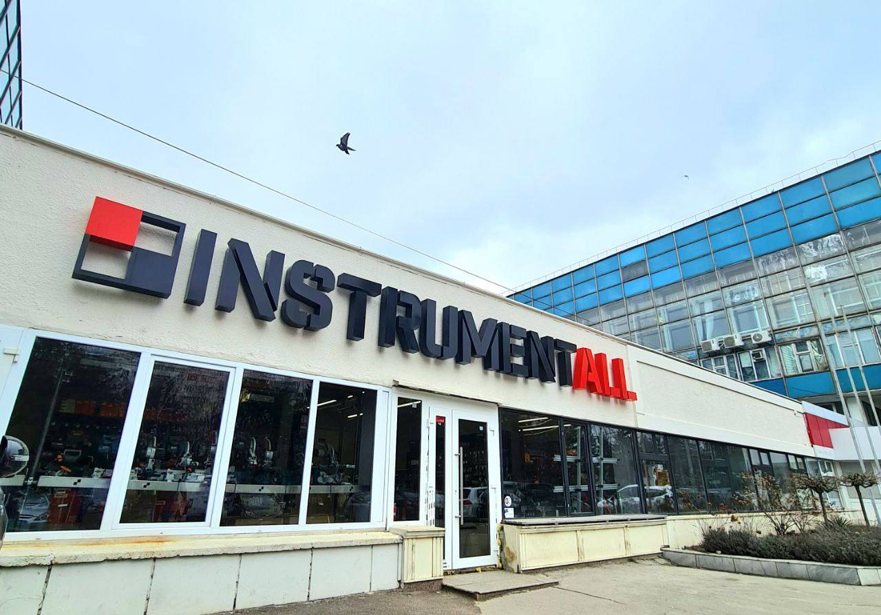 Instrumental storefront exterior with clear signage and modern facade