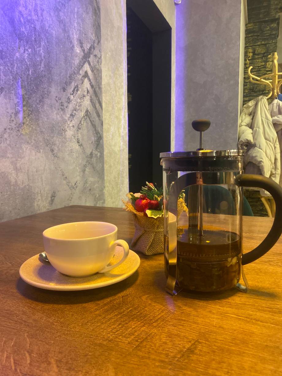 Coffee service with French press and ambient mood lighting