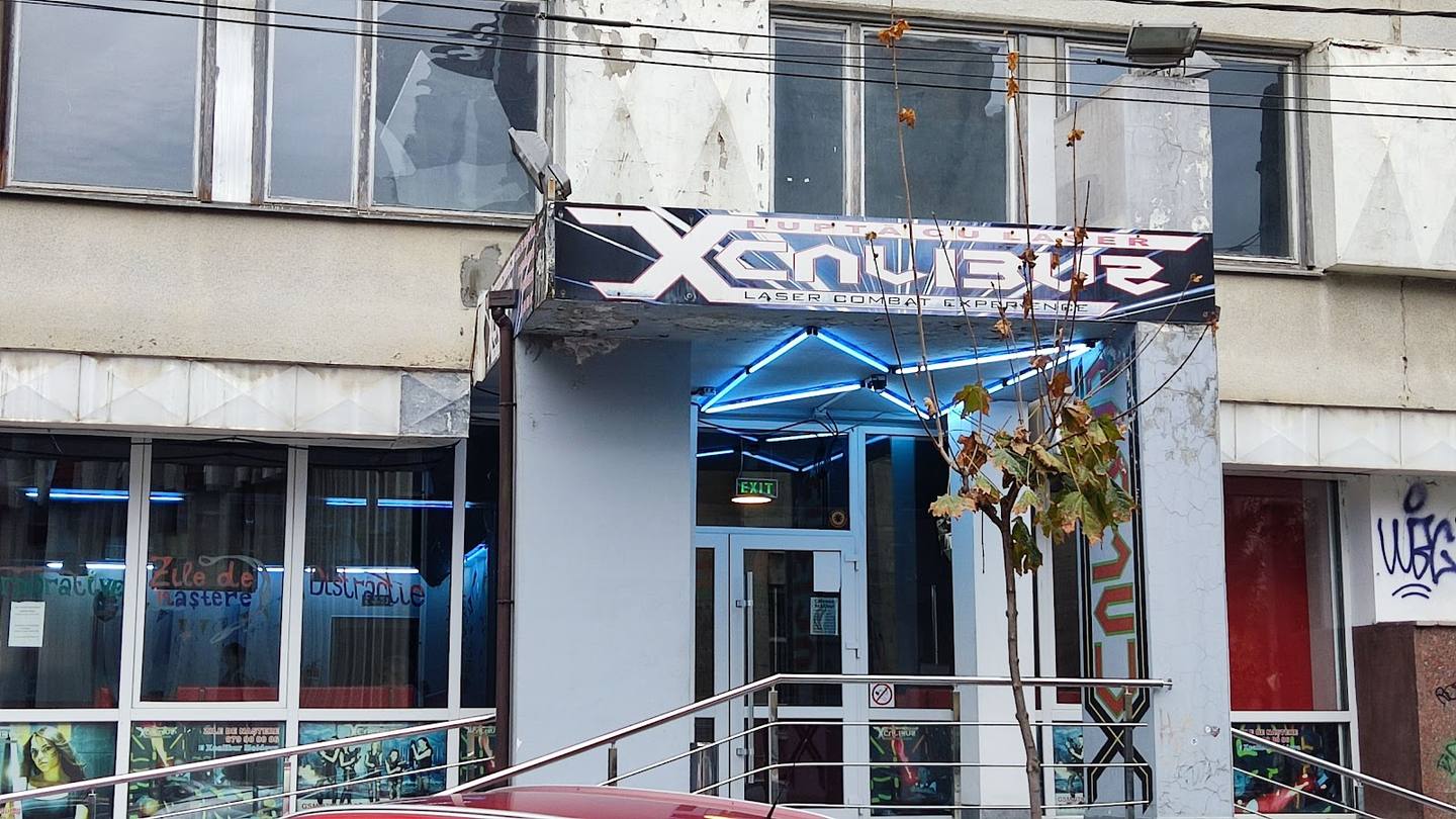 Aqua Blue storefront with blue awning and glass entrance on street level