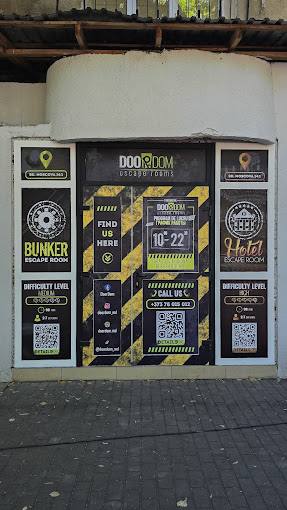 Doodroom escape room venue storefront with branded entrance gate