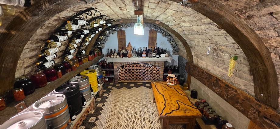 Historic stone cellar with barrel storage and arched vaulting