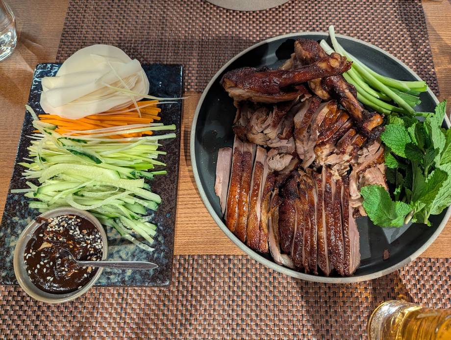 Plated Korean grilled meat with vegetables and side dishes