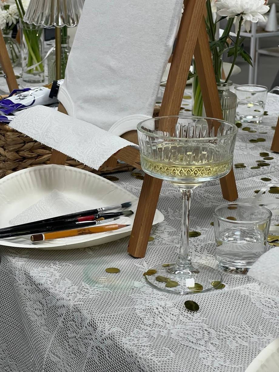 Close-up of table setting with wine glass and place cards