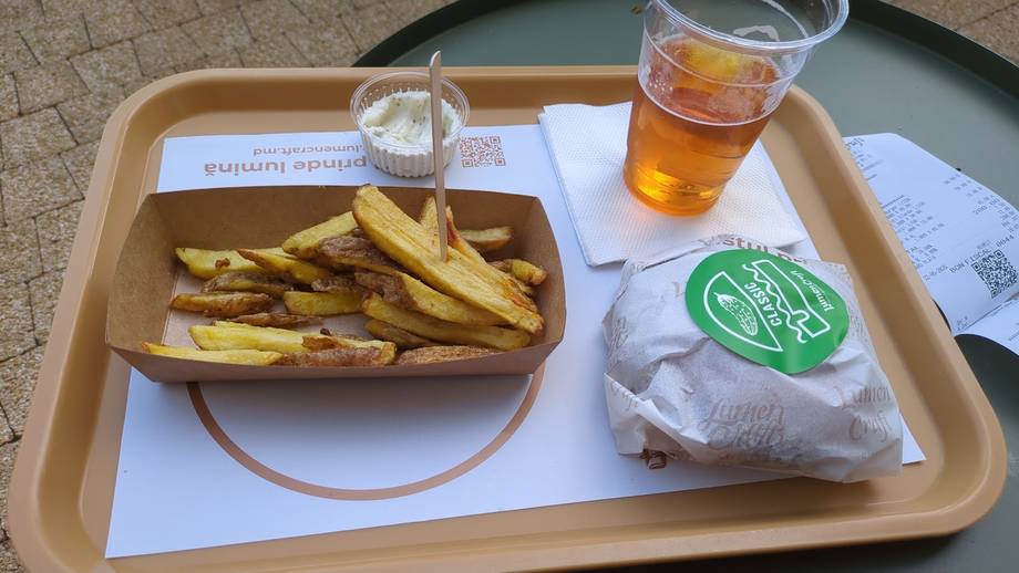 Fast food meal with fries, sandwich, and beverage on tray
