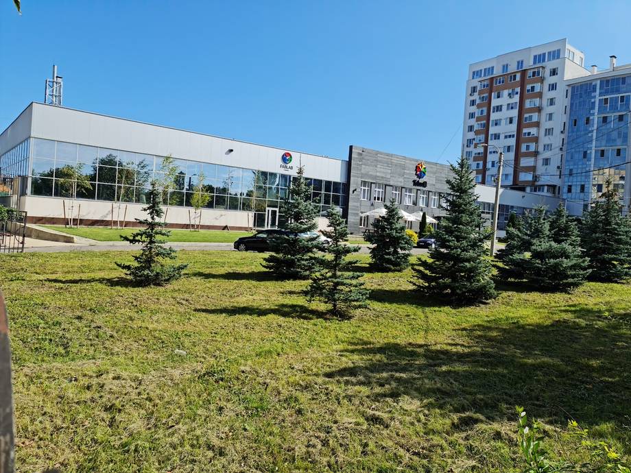 Modern event venue exterior with landscaped grounds and contemporary architecture