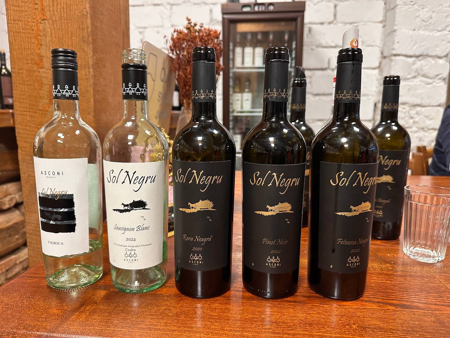 Selection of Sal Negra wine bottles displayed on wooden table