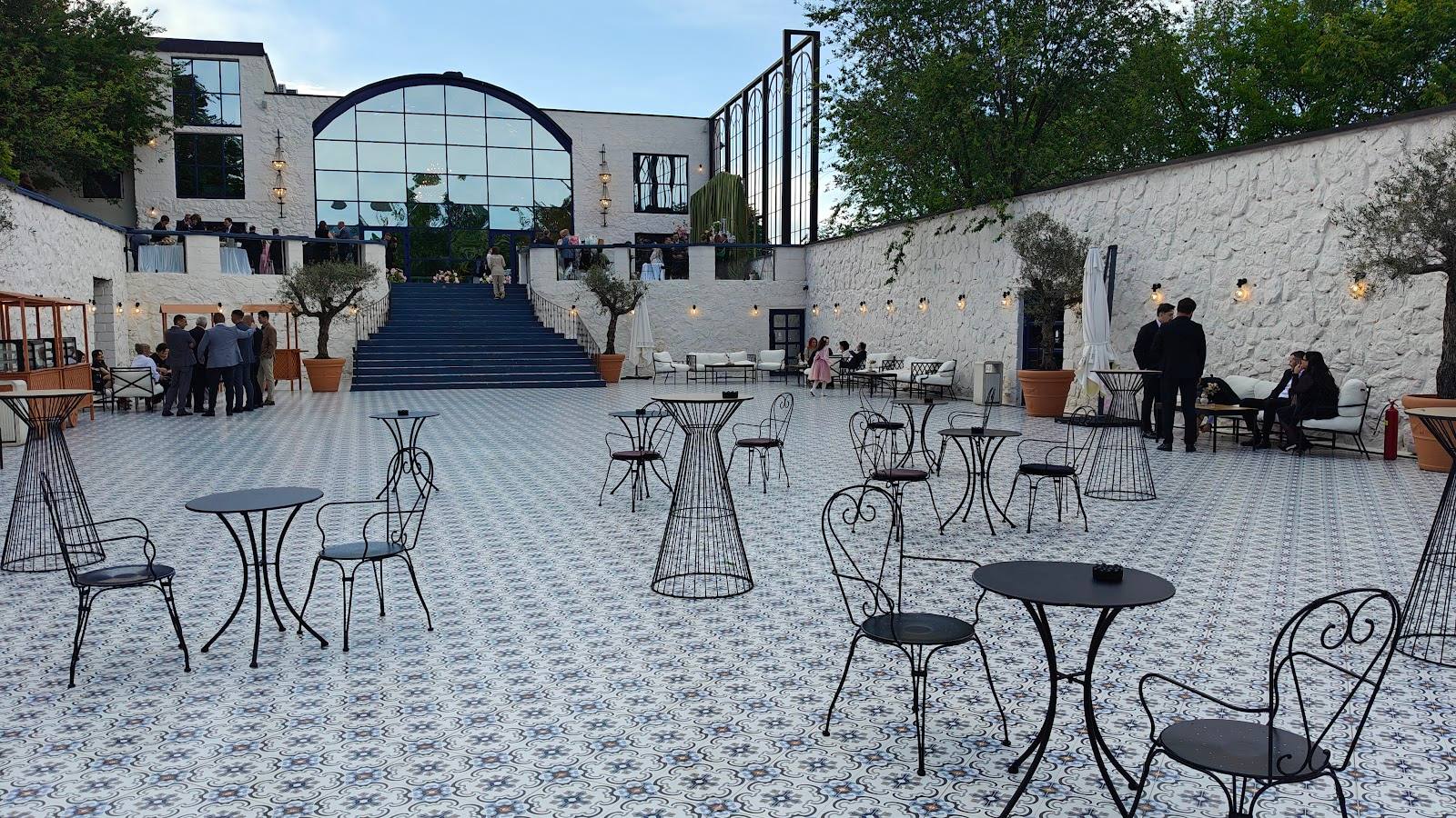 Open-air courtyard with modern architecture and scattered seating