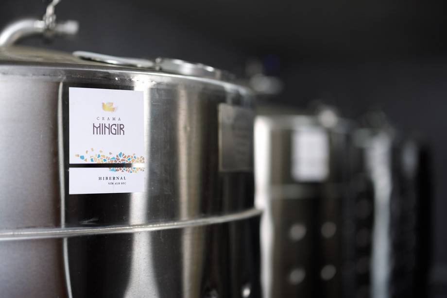 Steel fermentation or storage vessels with vintage wine label detail