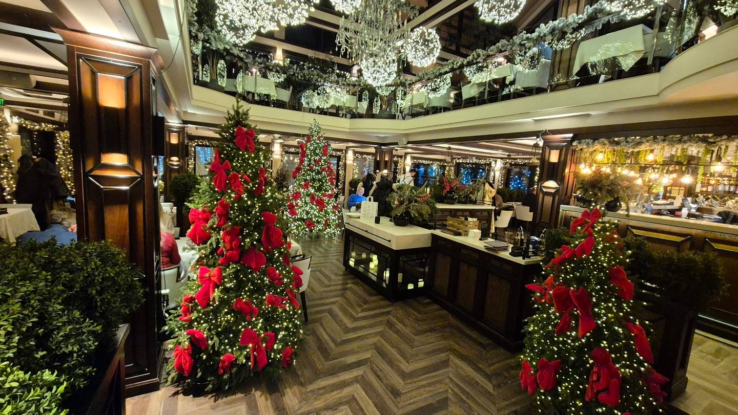 Elegant interior with festive floral displays and jewelry counter lighting