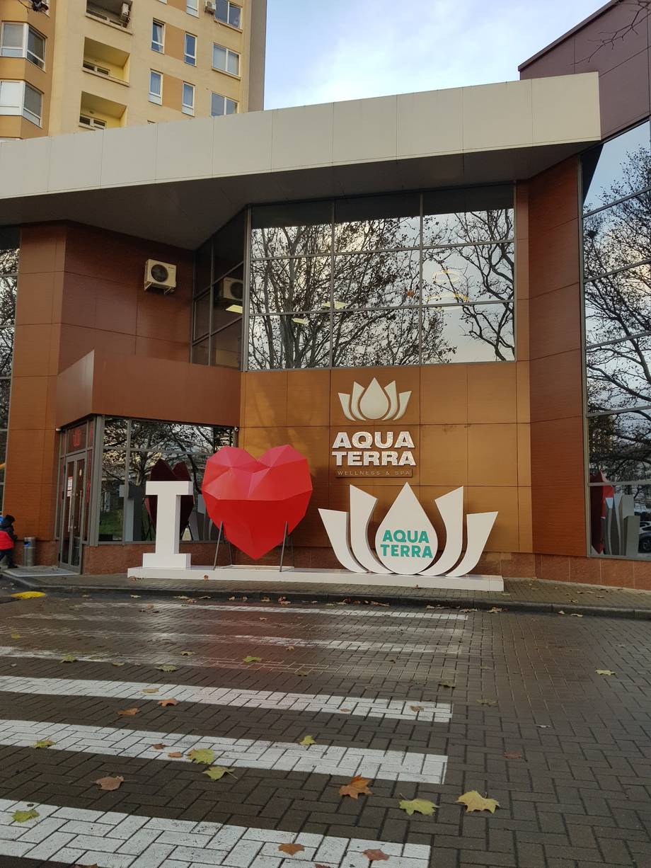 Aqua Terra spa exterior with branded storefront and logo signage