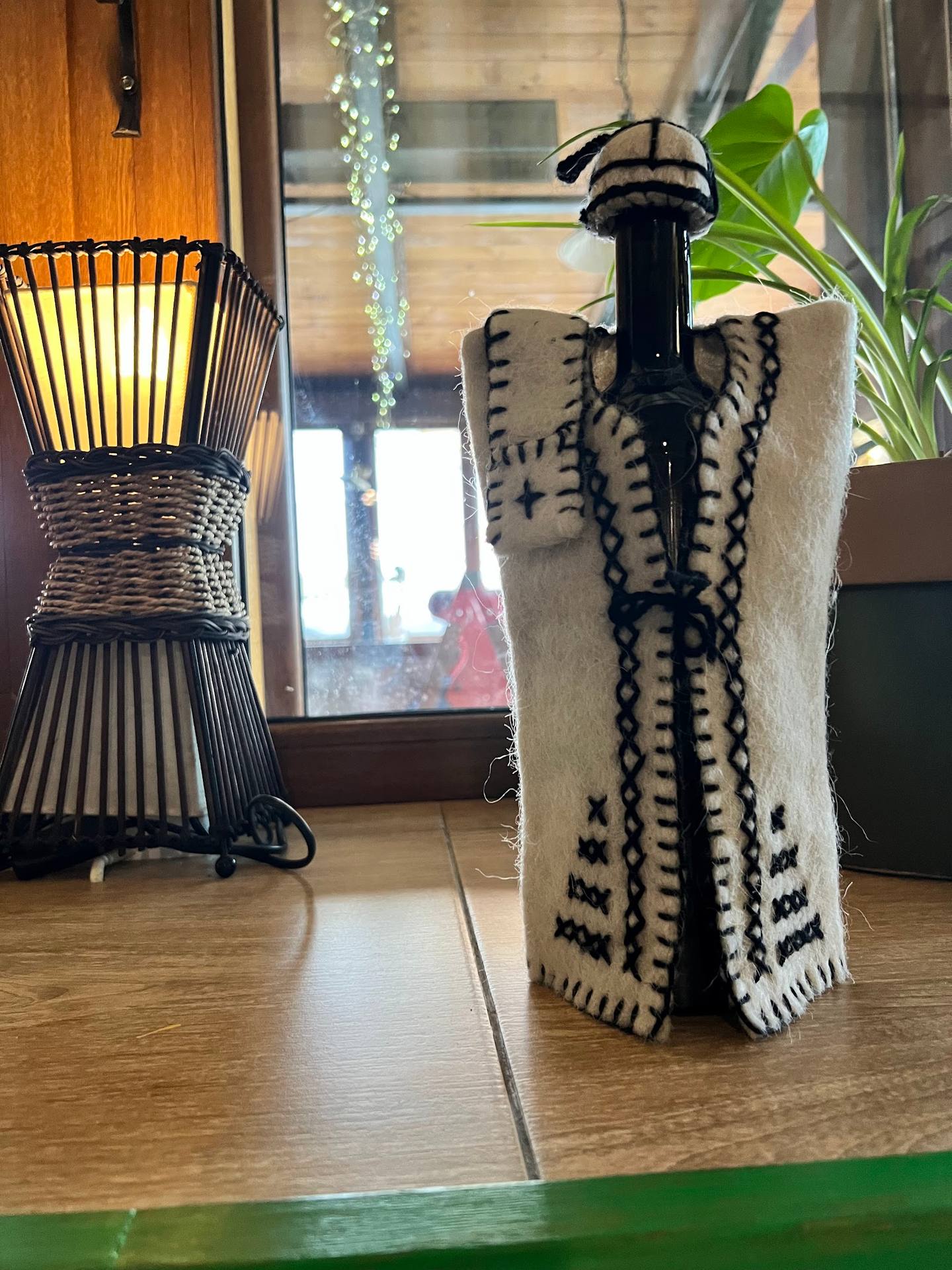 Decorative tissue holder and woven basket accent on wooden table
