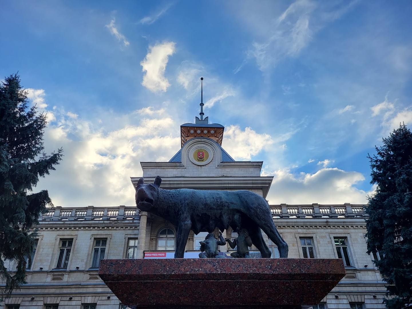 Iconic town hall building with clock tower and elephant sculpture monument