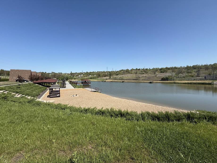 Outdoor recreational venue with private fishing lake and natural landscape