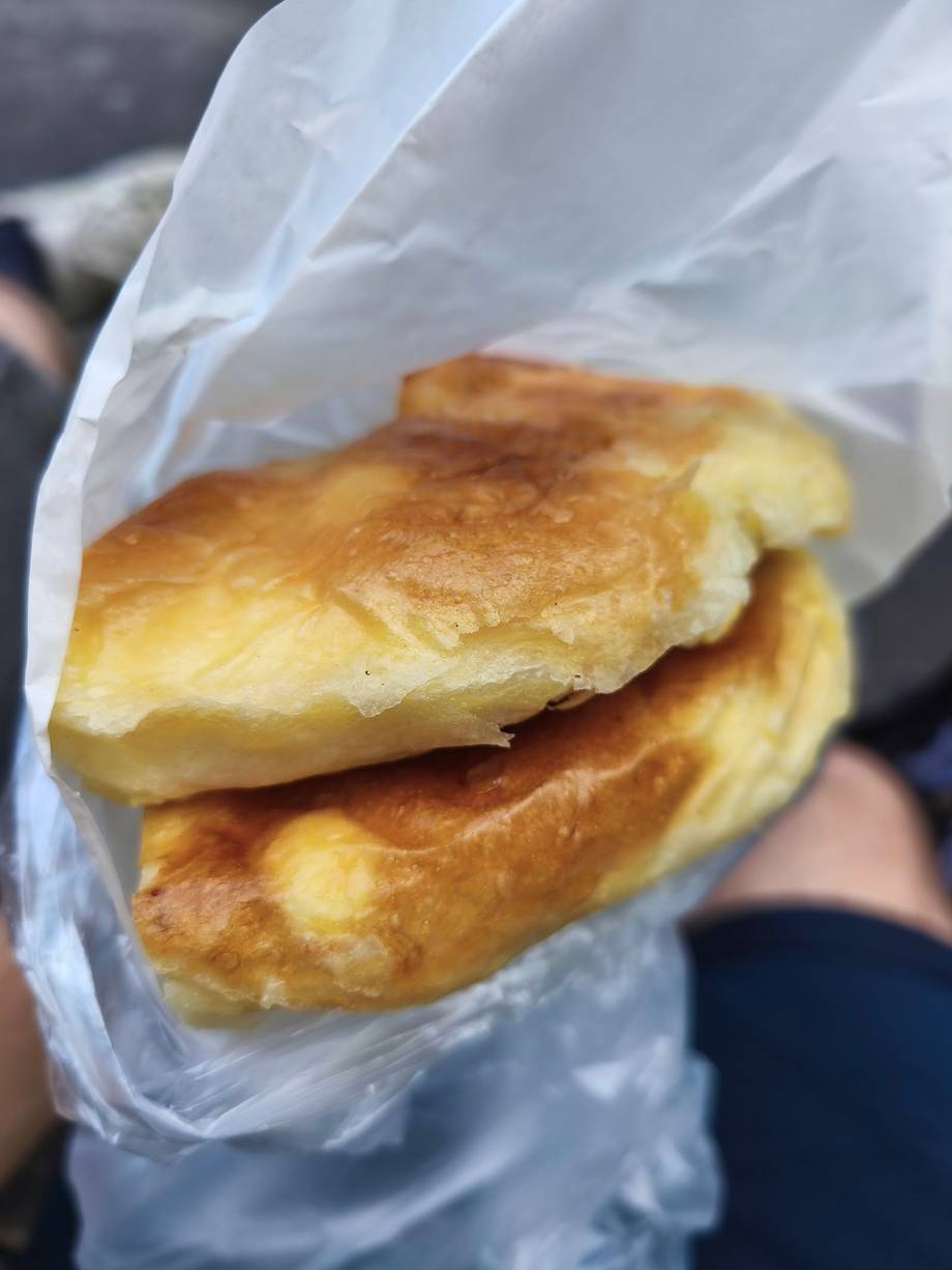 Golden pastries wrapped in paper napkin