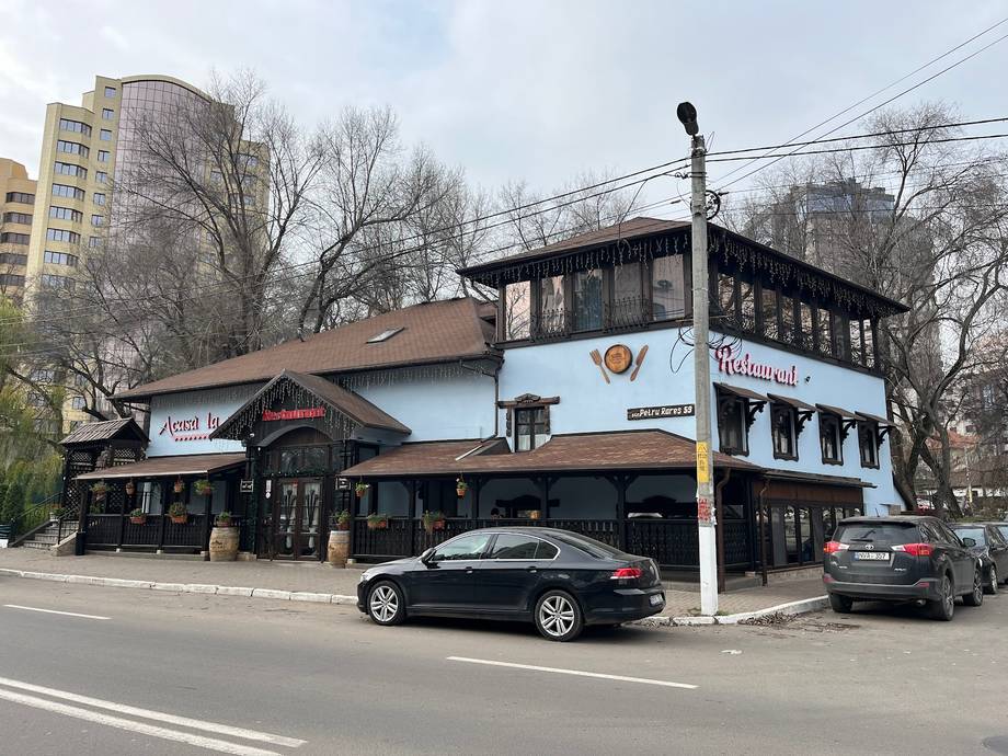 Storefront exterior with distinctive two-story architecture and street-facing entrance