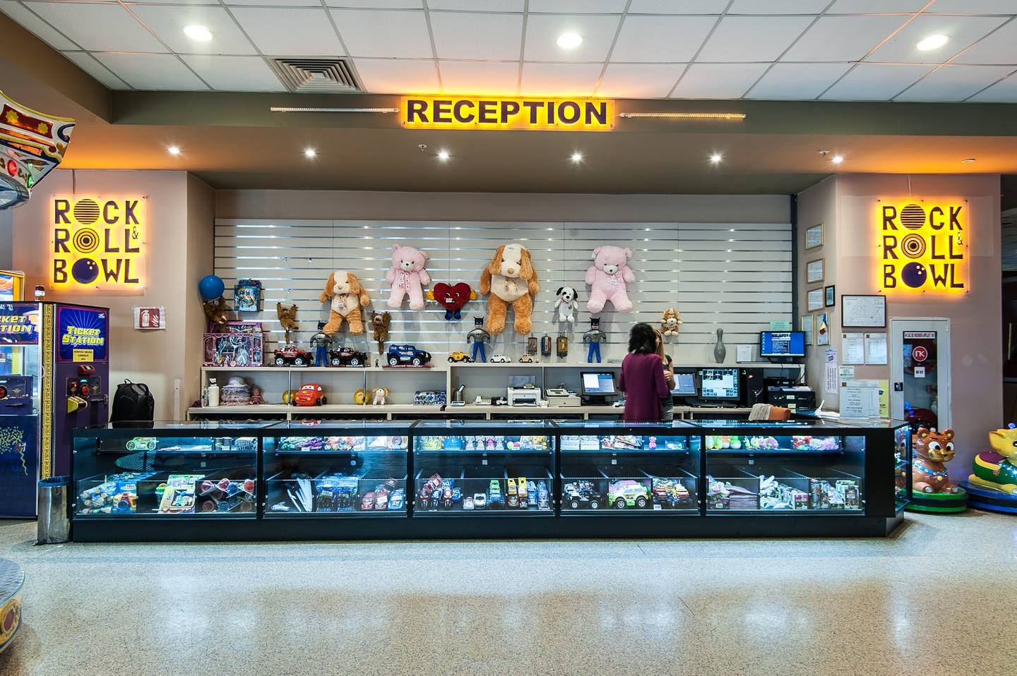Rock and Roll memorabilia museum reception desk with neon signage and display cases