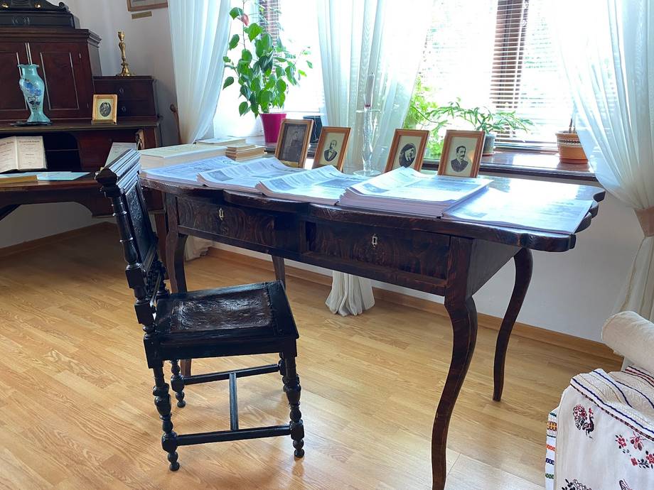 Workspace desk with chair and natural light from windows