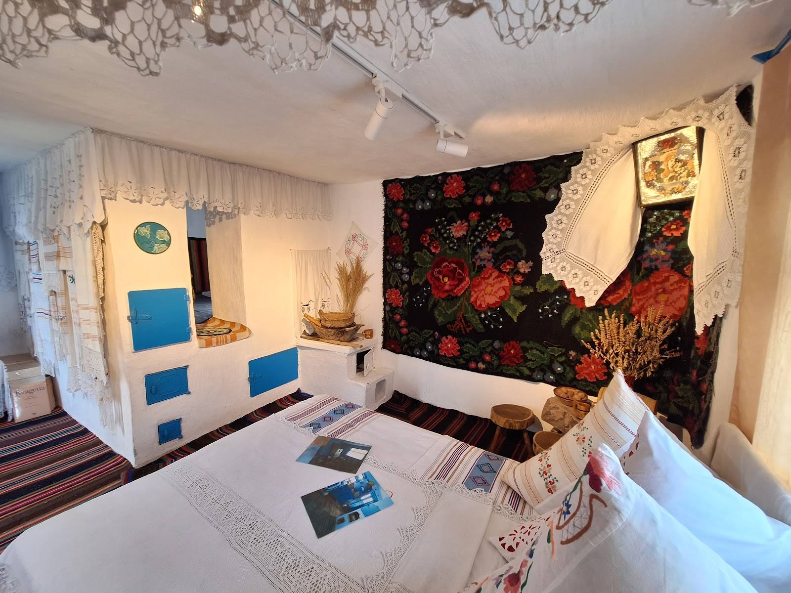Modern guest room with decorative floral wall panels and minimalist furnishings