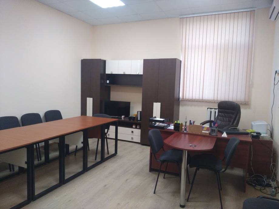 Office workspace with two desk areas and partition divider