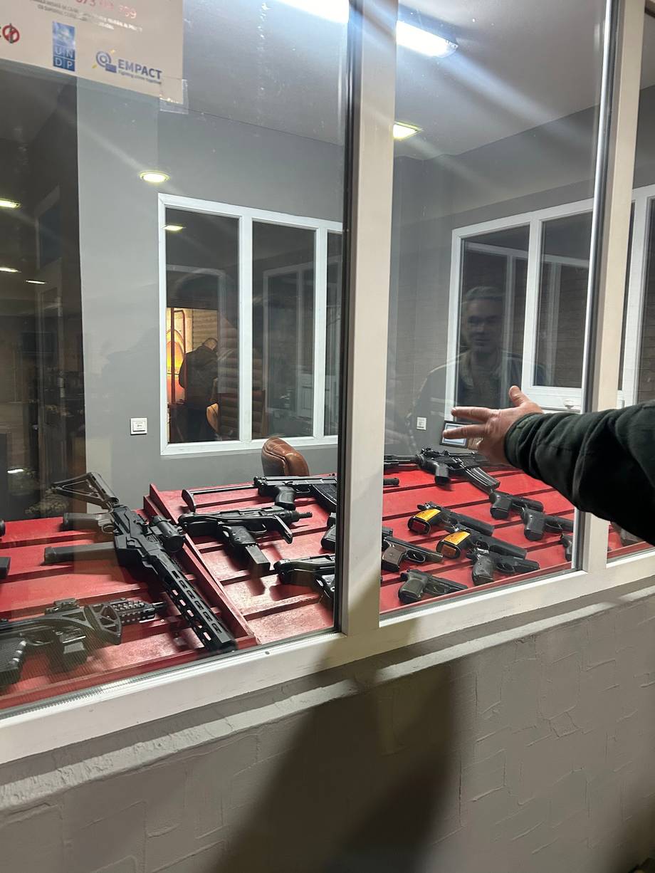 Shooting range interior with airsoft/paintball equipment on padded floor