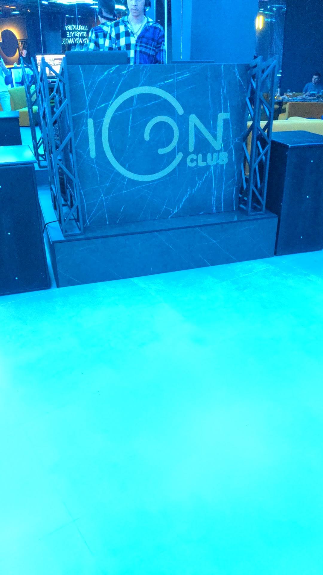 ION Club dance floor with DJ booth and blue ambient lighting