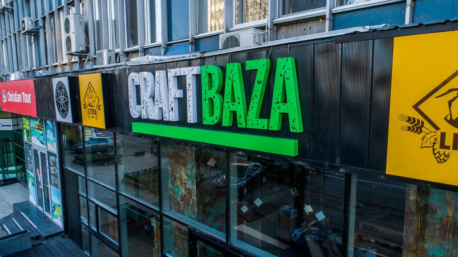CRAFT BAZA storefront with bright neon green signage and market-style facade