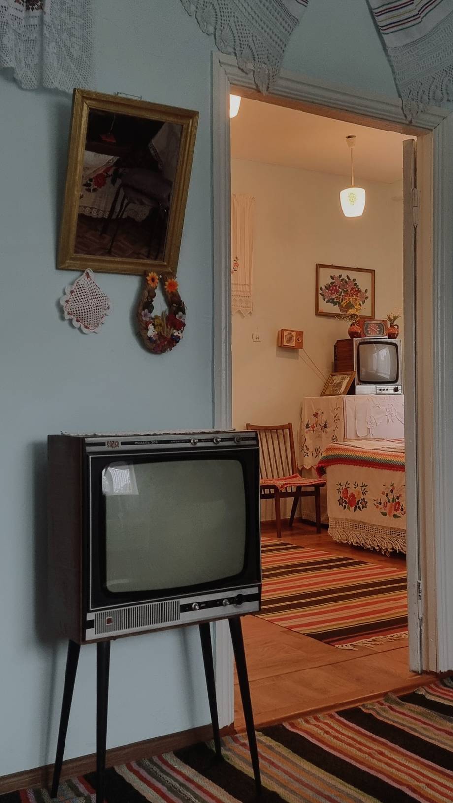 Vintage-themed room with retro TV set and rustic décor