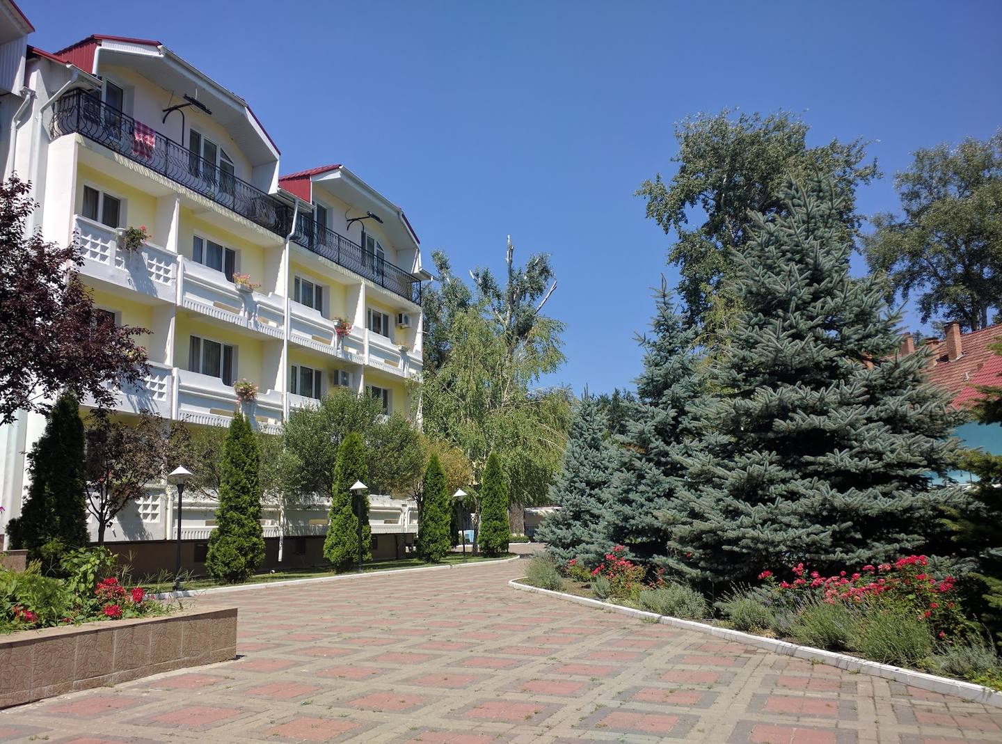 Hotel exterior with courtyard access and landscaped grounds