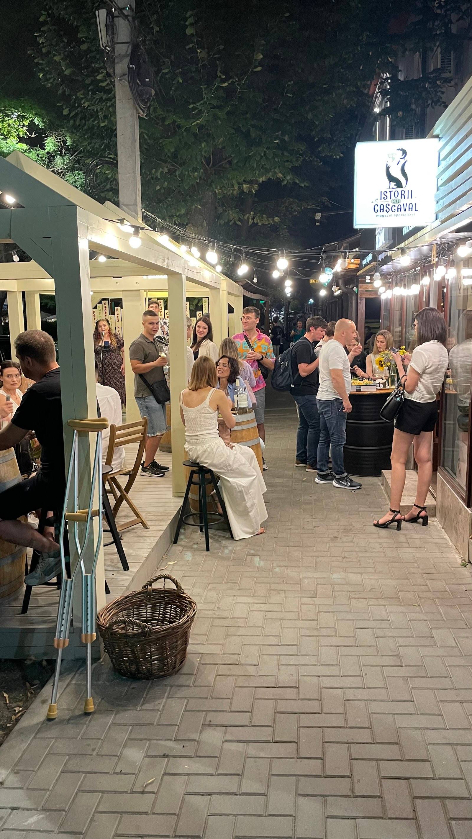 Evening terrace with signage, string lights, and guests dining outdoors at Casablanca venue