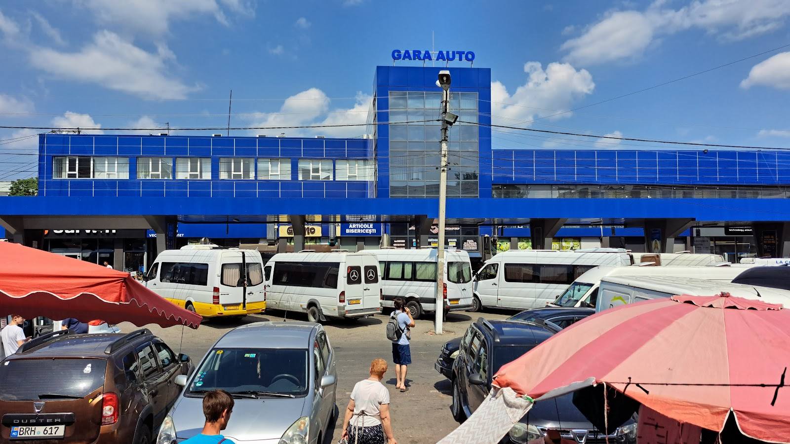 DABA AUTO car dealership storefront with blue facade and parking lot