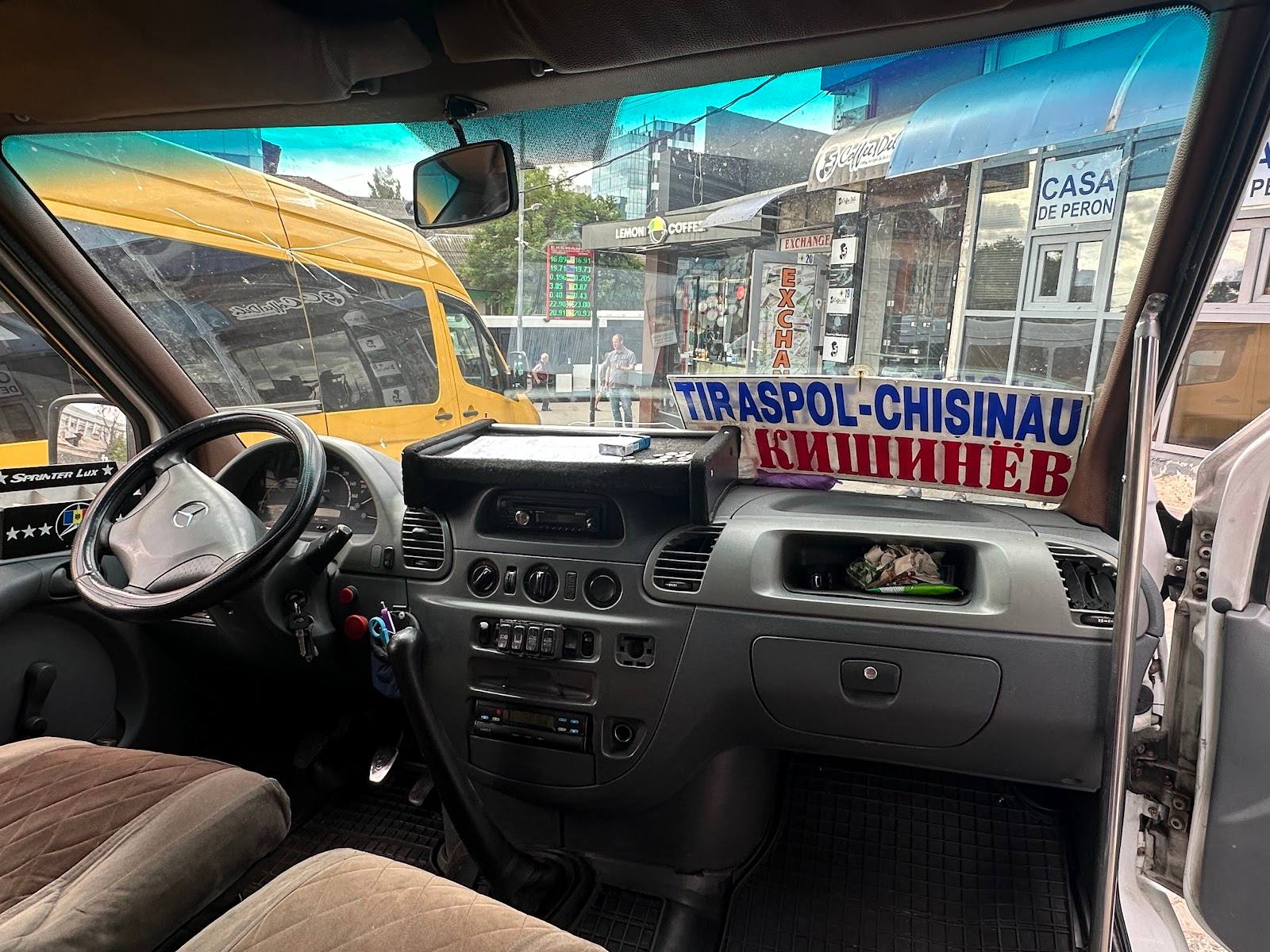 Minibus interior with street view of Chişinău storefront