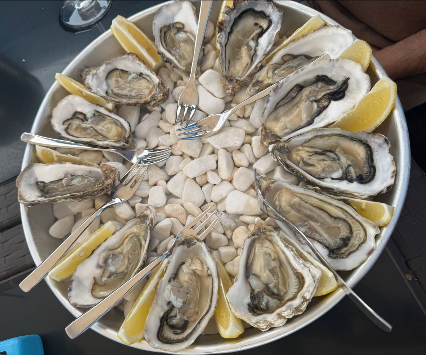 Oyster platter with lemon garnish and ice center