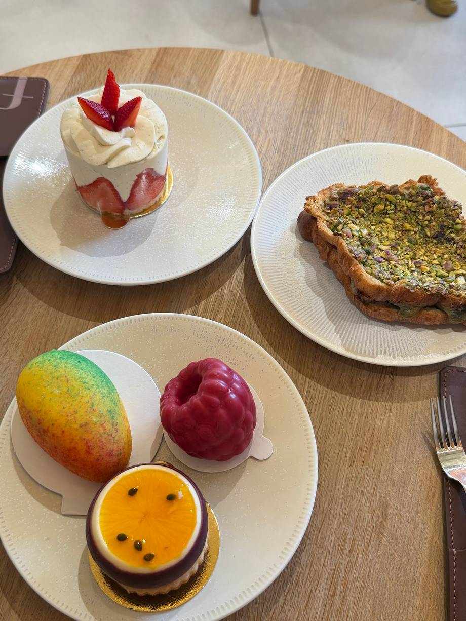 Assorted pastries and desserts on wooden table