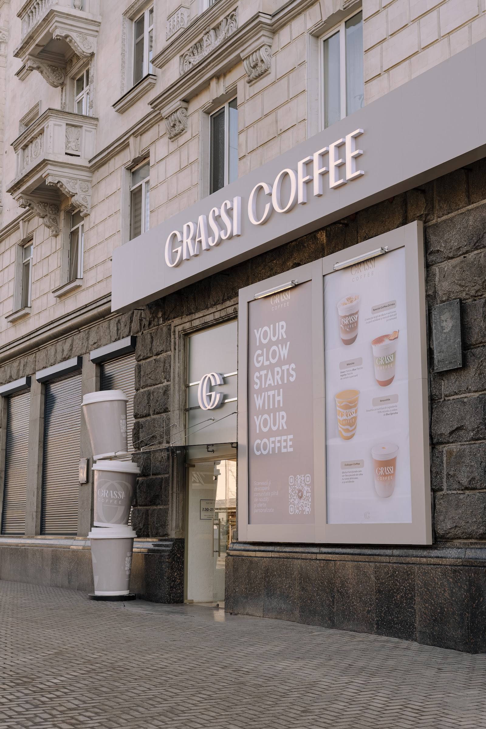 Grassi Coffee storefront with signage and menu displays on modern street-level facade