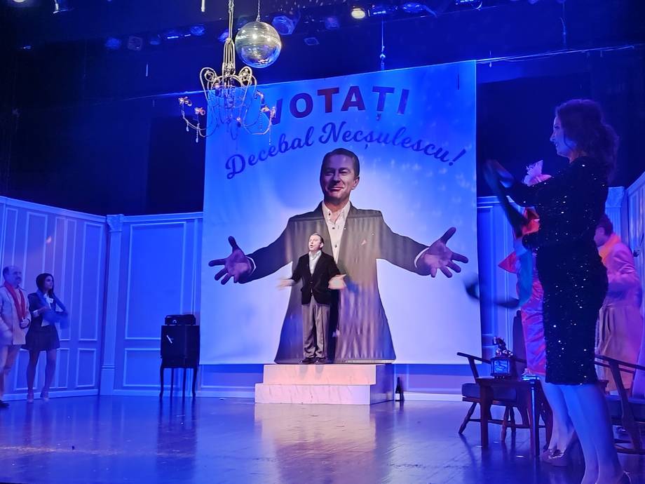 Theater performance or comedy show with stage setup and blue ambient lighting