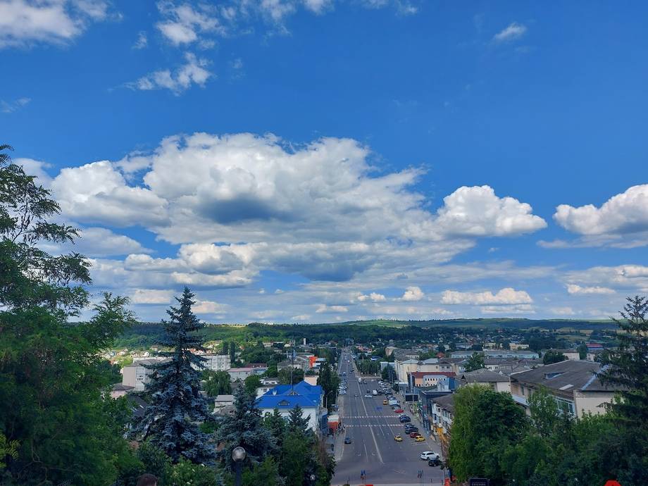 Scenic aerial view of Moldova town landscape with blue sky and clouds