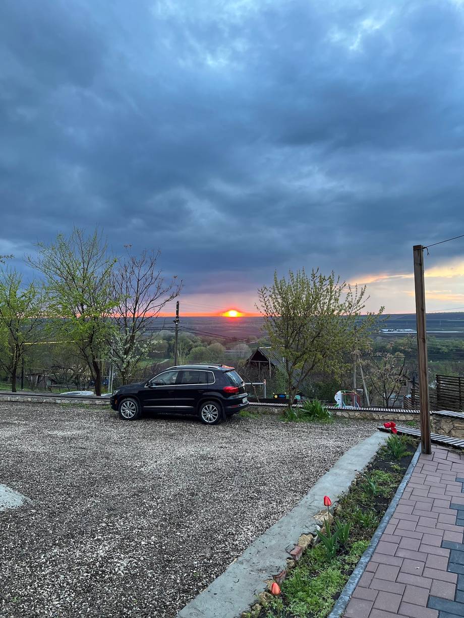 Sunset view from hilltop parking area with distant landscape