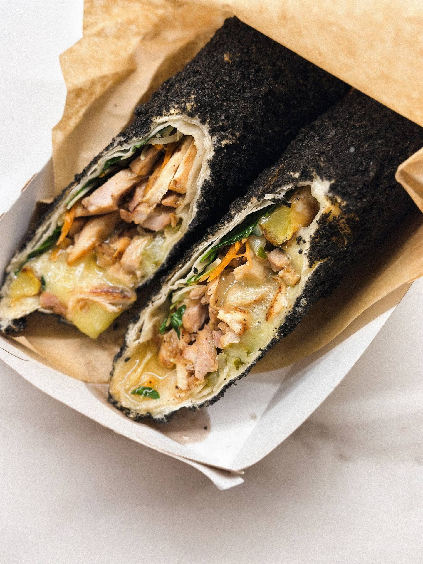 Nori-wrapped hand rolls with shrimp, avocado and fresh vegetables