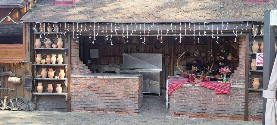 Charming brick storefront with flower boxes and rustic wooden decor