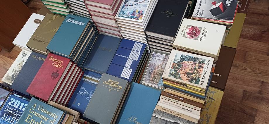Overhead shot of books and wine publications arranged on wooden floor