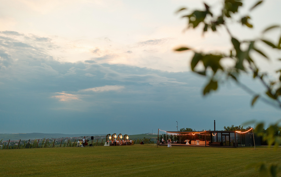 Rural venue with open-air setup at dusk in Moldova countryside
