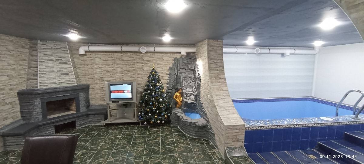 Spa complex with fireplace lounge area and indoor pool visible
