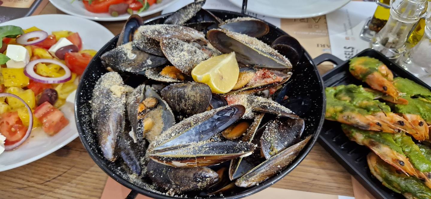 Grilled fish and seafood platter with lemon and herbs