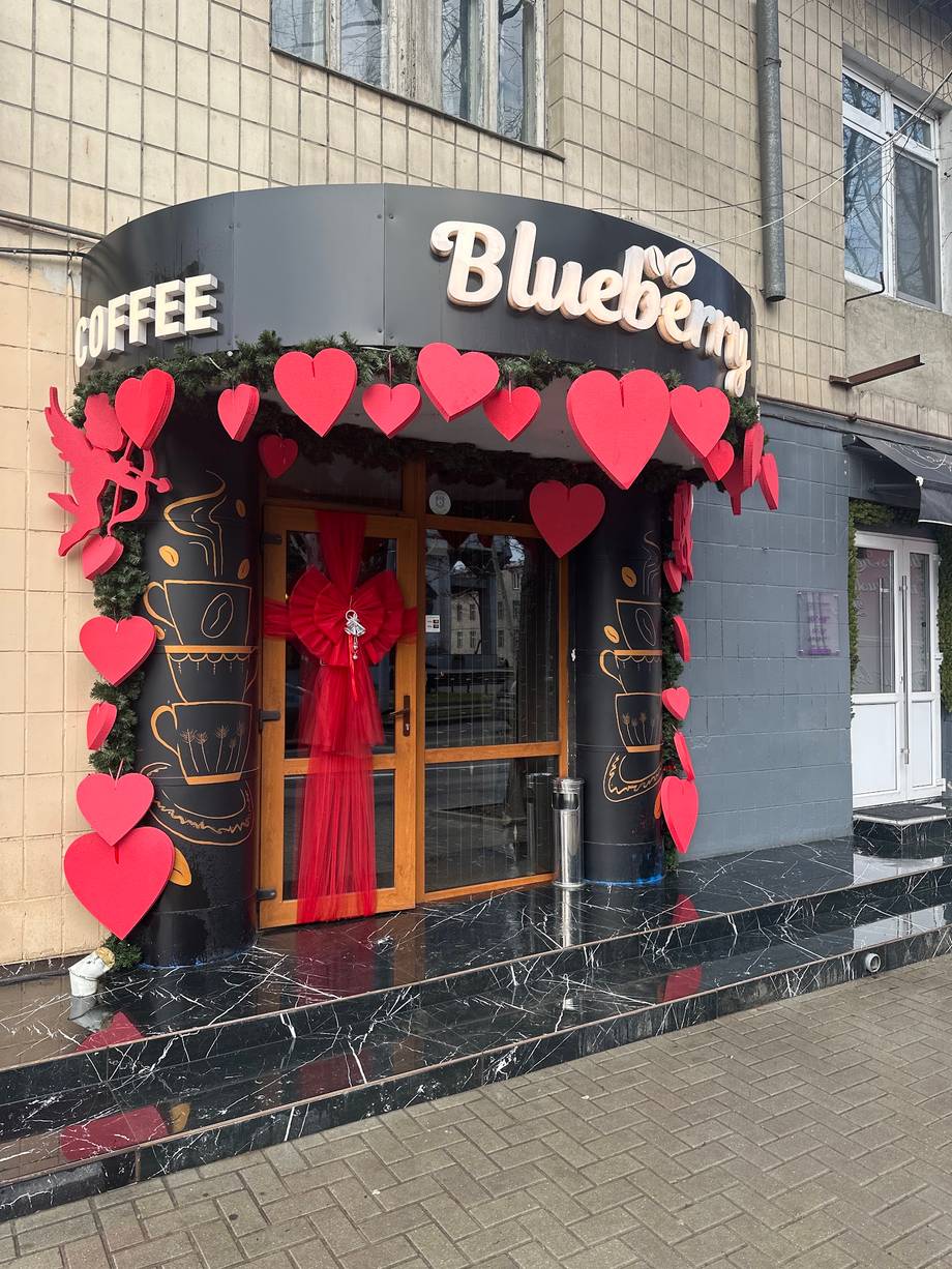 Blueberry café storefront with distinctive red heart Valentine's decoration and dark exterior