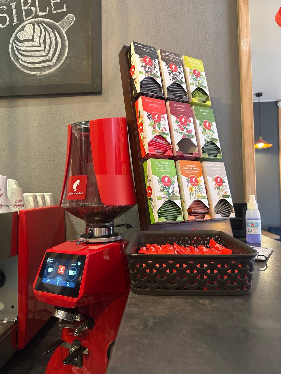 Coffee machine and tea selection display at counter