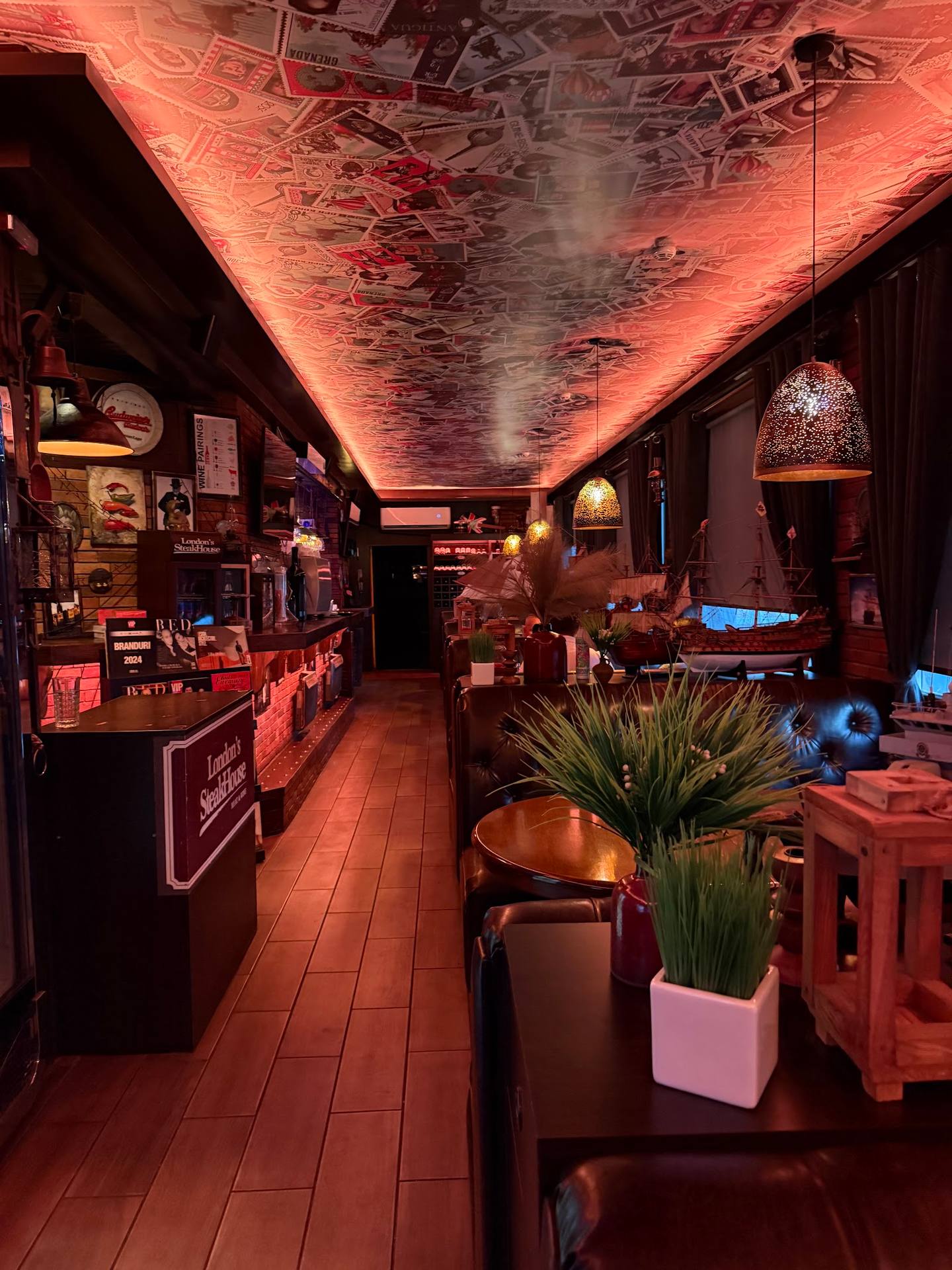 Narrow wellness shop interior with warm ambient lighting and decorative displays