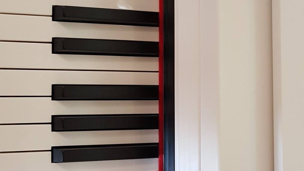 Close-up of piano keys showing black and white keys