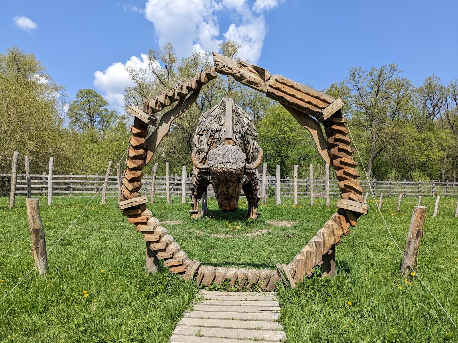 Wooden obstacle course with circular gate frame in outdoor adventure venue