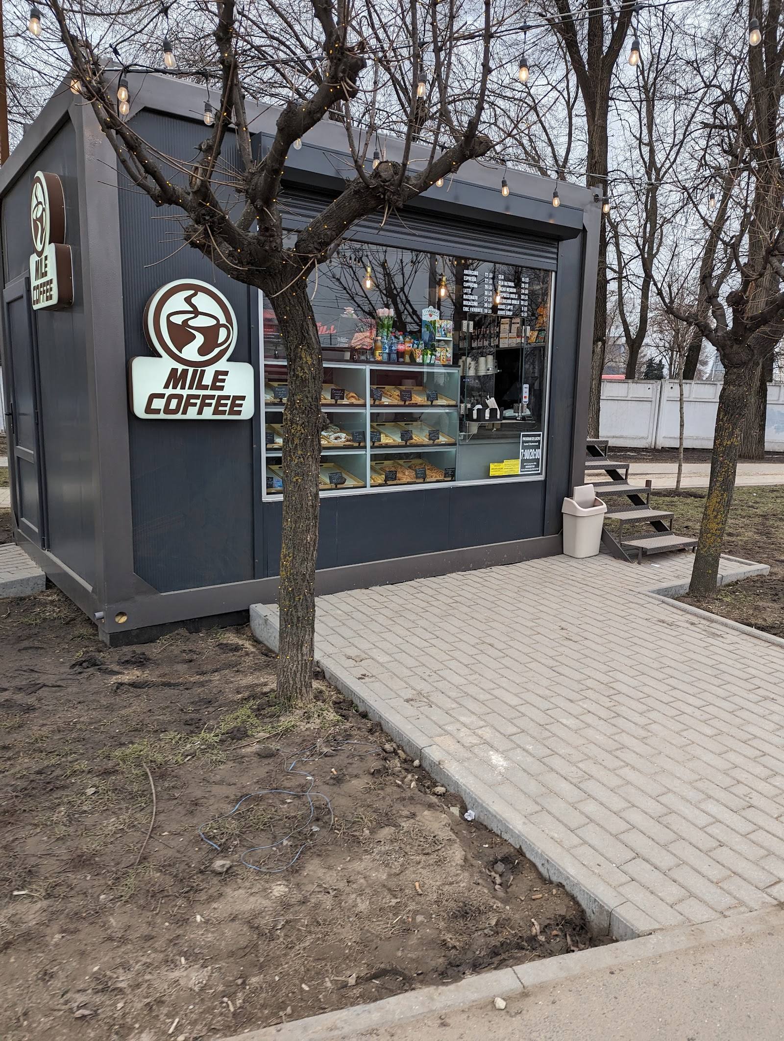 Mile Coffee kiosk with branded storefront and service counter in outdoor park setting